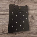 T-shirt Ottoman Kumus nera in cotone con stampa all-over di piccole palme bianche e taschino sul petto